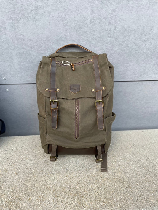 Sac à dos kaki au look vintage en toile waxée et cuir